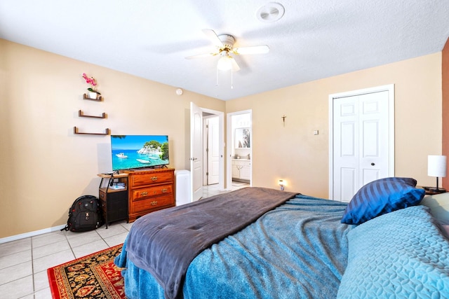 6412 Saint Josephs Ave NW, Albuquerque, NM 87120 - bedroom featuring light tile patterned floors, a closet, and ceiling fan