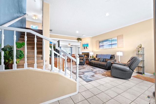 6412 Saint Josephs Ave NW, Albuquerque, NM 87120 - living area featuring stairs, tile patterned floors, a warm lit fireplace, crown molding, and recessed lighting