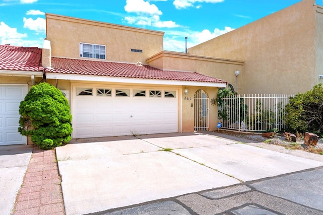 6412 Saint Josephs Ave NW, Albuquerque, NM 87120 - view of front of property featuring stucco siding, concrete driveway, and a tile roof