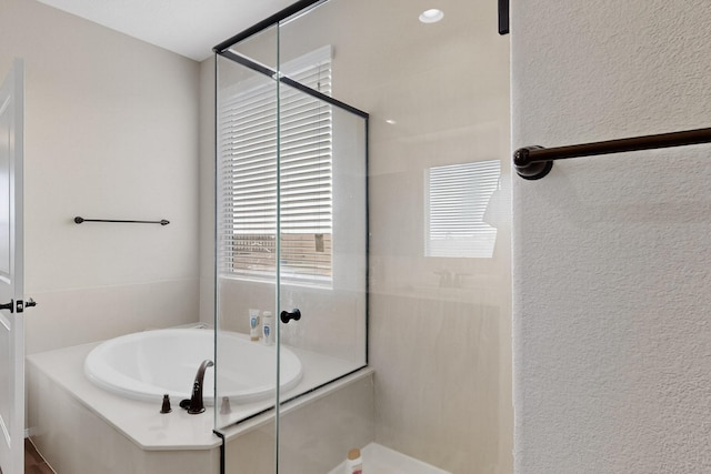 6417 Kings Cyn NE, Rio Rancho, NM 87144 - bathroom with a bath, a shower with door, and a textured wall