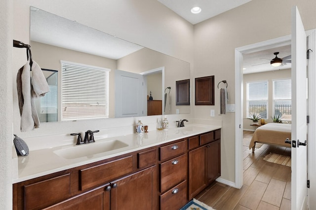 6417 Kings Cyn NE, Rio Rancho, NM 87144 - full bath with ensuite bathroom, double vanity, a ceiling fan, wood finished floors, and recessed lighting