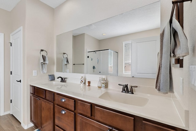6417 Kings Cyn NE, Rio Rancho, NM 87144 - bathroom featuring a shower stall and double vanity