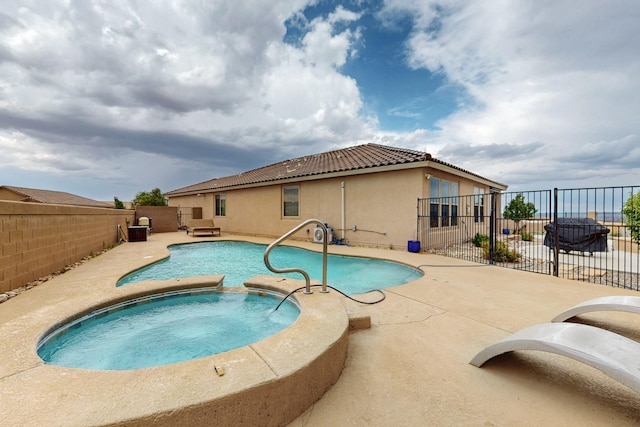 6417 Kings Cyn NE, Rio Rancho, NM 87144 - view of swimming pool featuring a patio, a fenced backyard, and a pool with connected hot tub