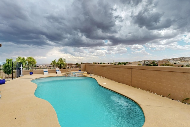 6417 Kings Cyn NE, Rio Rancho, NM 87144 - view of pool featuring a pool with connected hot tub and a patio area