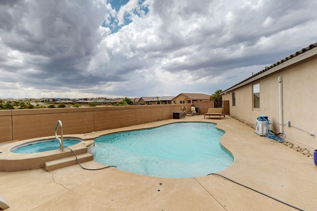 6417 Kings Cyn NE, Rio Rancho, NM 87144 - view of pool featuring a fenced backyard, a patio area, and a pool with connected hot tub