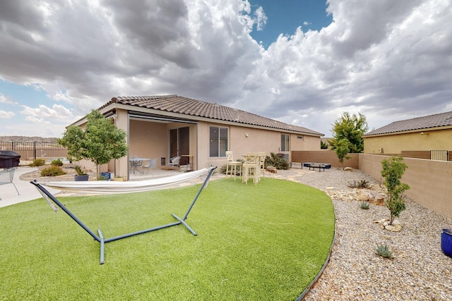 6417 Kings Cyn NE, Rio Rancho, NM 87144 - rear view of property with a tiled roof, a fenced backyard, stucco siding, and a patio