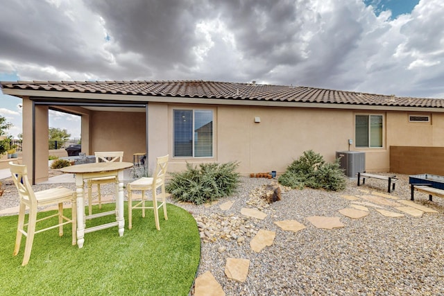 6417 Kings Cyn NE, Rio Rancho, NM 87144 - back of property with stucco siding, a tiled roof, and a patio area