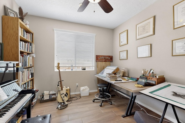 6417 Kings Cyn NE, Rio Rancho, NM 87144 - home office with a ceiling fan, wood finished floors, and a textured ceiling