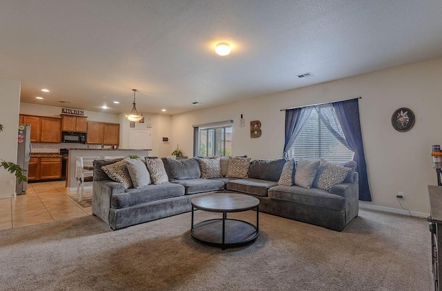 148 El Camino Loop NW, Rio Rancho, NM 87144 - living area featuring light colored carpet and recessed lighting