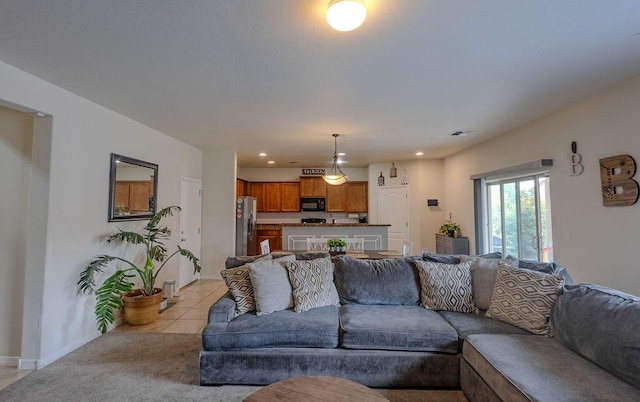 148 El Camino Loop NW, Rio Rancho, NM 87144 - living room with recessed lighting and light tile patterned floors