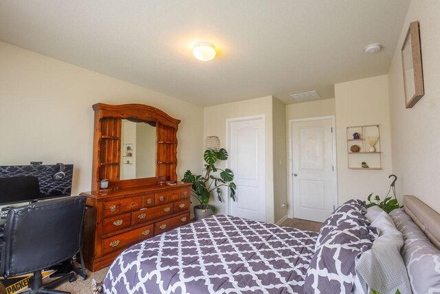 148 El Camino Loop NW, Rio Rancho, NM 87144 - carpeted bedroom featuring baseboards
