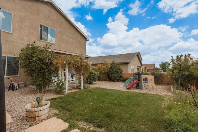 148 El Camino Loop NW, Rio Rancho, NM 87144 - fenced backyard with a playground