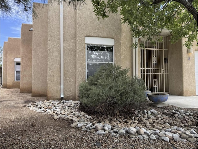 5400 Pegasus Dr NW, Albuquerque, NM 87120 - view of side of home featuring stucco siding