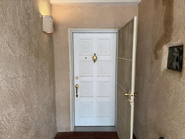 5400 Pegasus Dr NW, Albuquerque, NM 87120 - doorway to property featuring stucco siding