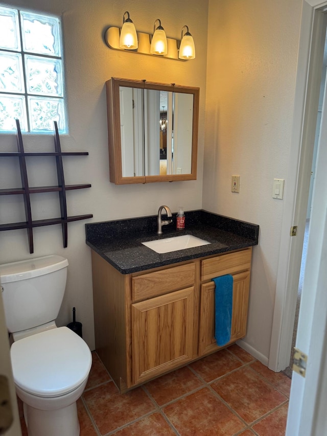 5400 Pegasus Dr NW, Albuquerque, NM 87120 - half bath featuring vanity and tile patterned flooring