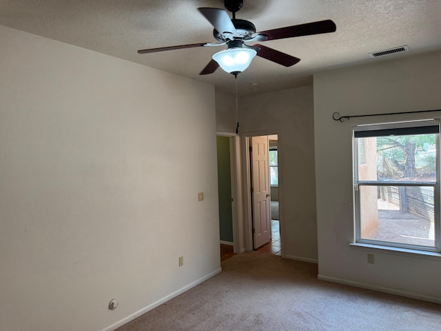 5400 Pegasus Dr NW, Albuquerque, NM 87120 - carpeted empty room with a textured ceiling and a ceiling fan