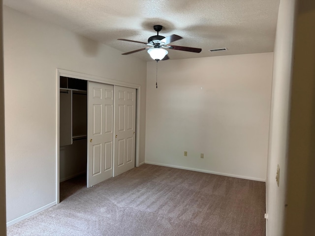 5400 Pegasus Dr NW, Albuquerque, NM 87120 - unfurnished bedroom with a textured ceiling, carpet, a closet, and ceiling fan