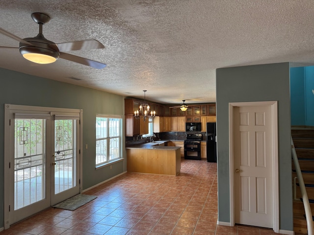 5400 Pegasus Dr NW, Albuquerque, NM 87120 - kitchen featuring black appliances, a peninsula, a chandelier, a ceiling fan, and a textured ceiling