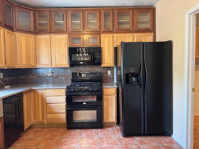 5400 Pegasus Dr NW, Albuquerque, NM 87120 - kitchen featuring black appliances, light tile patterned floors, tasteful backsplash, and glass insert cabinets