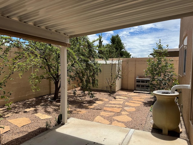 5400 Pegasus Dr NW, Albuquerque, NM 87120 - fenced backyard featuring a patio