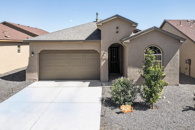4293 Crowned Eagle Loop NE, Rio Rancho, NM 87144 - view of front of property with an attached garage, driveway, stucco siding, and roof with shingles