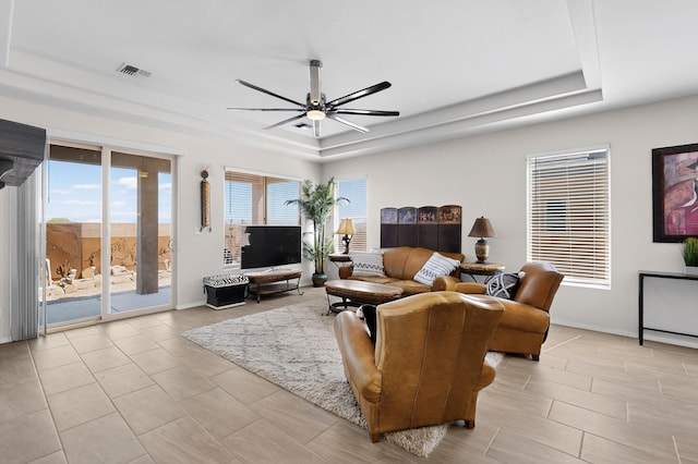 4293 Crowned Eagle Loop NE, Rio Rancho, NM 87144 - living area with a tray ceiling and ceiling fan