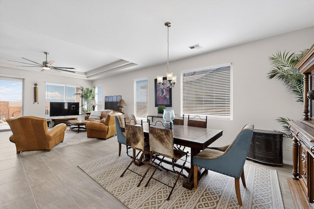 4293 Crowned Eagle Loop NE, Rio Rancho, NM 87144 - dining room featuring a chandelier, ceiling fan, and a raised ceiling