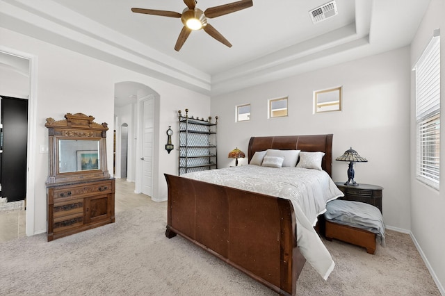 4293 Crowned Eagle Loop NE, Rio Rancho, NM 87144 - bedroom featuring light colored carpet, arched walkways, and multiple windows
