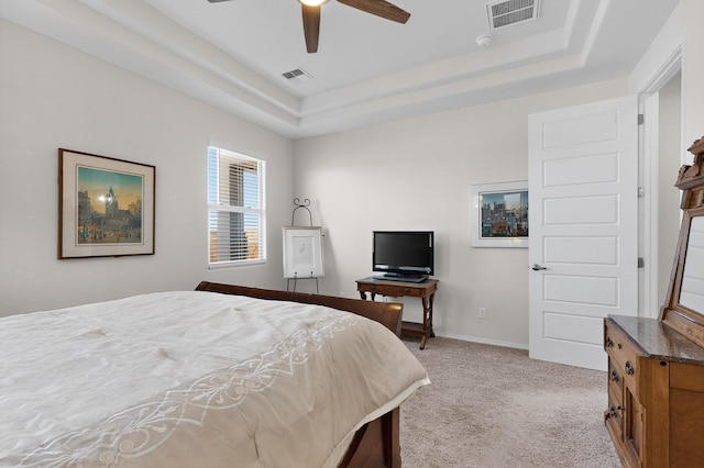 4293 Crowned Eagle Loop NE, Rio Rancho, NM 87144 - bedroom with a raised ceiling, light colored carpet, and ceiling fan