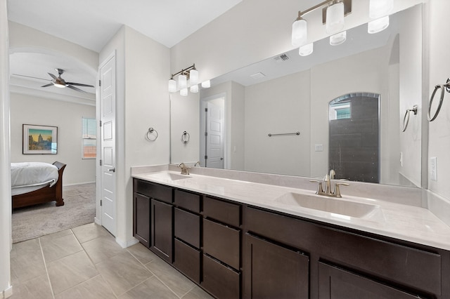 4293 Crowned Eagle Loop NE, Rio Rancho, NM 87144 - ensuite bathroom featuring double vanity, ceiling fan, plenty of natural light, and tile patterned flooring