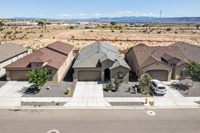 4293 Crowned Eagle Loop NE, Rio Rancho, NM 87144 - view from above of property featuring a mountain backdrop and a desert landscape