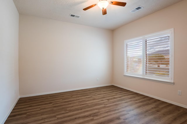 959 Salt Cedar Ct, Bernalillo, NM 87004 - spare room with dark wood-style flooring and ceiling fan