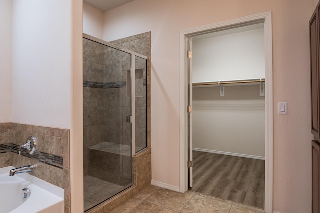 959 Salt Cedar Ct, Bernalillo, NM 87004 - full bath with a garden tub, a stall shower, a spacious closet, and tile patterned flooring