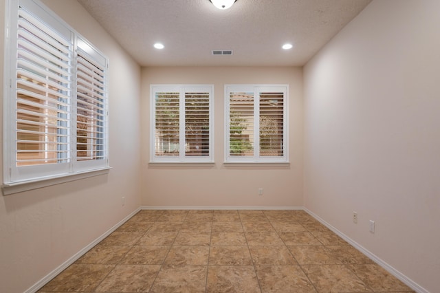 959 Salt Cedar Ct, Bernalillo, NM 87004 - empty room with a textured ceiling and recessed lighting