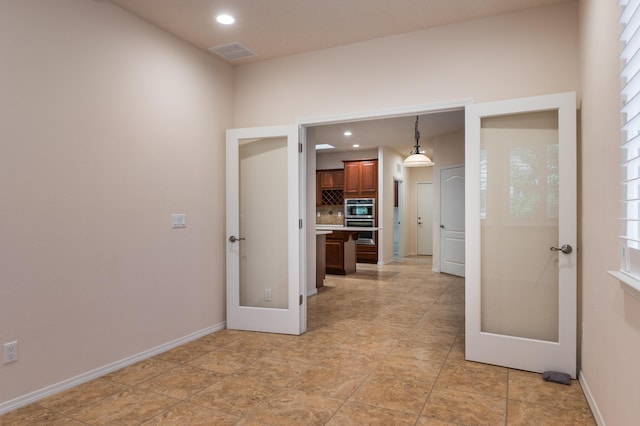 959 Salt Cedar Ct, Bernalillo, NM 87004 - kitchen with stainless steel double oven, tasteful backsplash, light countertops, recessed lighting, and french doors
