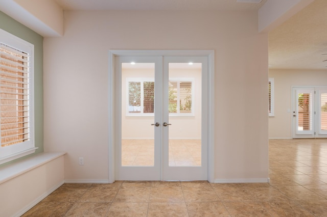 959 Salt Cedar Ct, Bernalillo, NM 87004 - doorway to outside featuring french doors and light tile patterned flooring