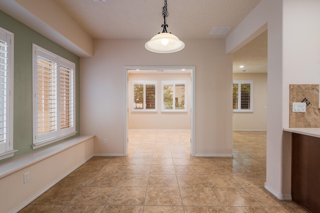 959 Salt Cedar Ct, Bernalillo, NM 87004 - empty room with healthy amount of natural light and a textured ceiling