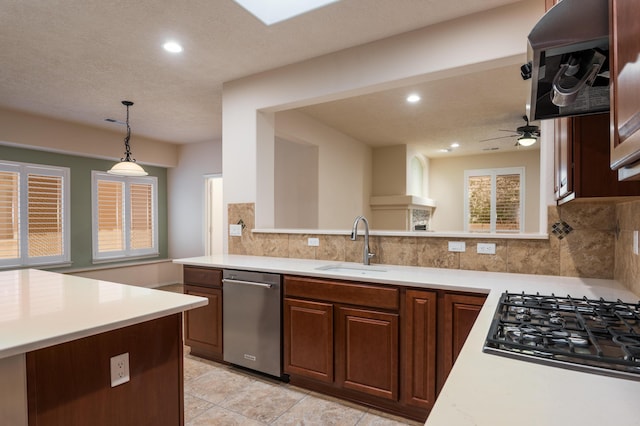 959 Salt Cedar Ct, Bernalillo, NM 87004 - kitchen featuring dishwasher, gas cooktop, light countertops, backsplash, and recessed lighting