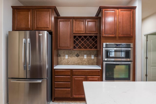 959 Salt Cedar Ct, Bernalillo, NM 87004 - kitchen featuring stainless steel appliances, light countertops, and decorative backsplash