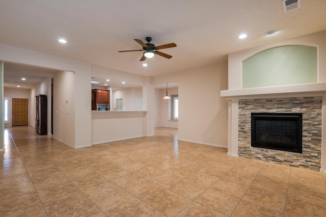 959 Salt Cedar Ct, Bernalillo, NM 87004 - unfurnished living room with ceiling fan, recessed lighting, and a fireplace