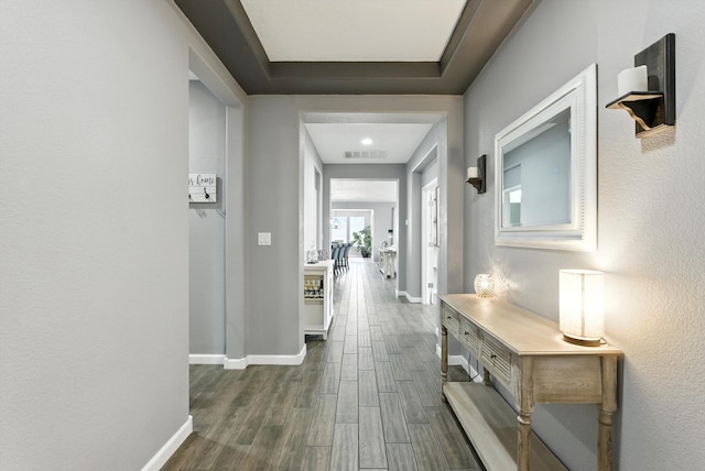 9015 Vista Dibujo Rd, Albuquerque, NM 87120 - hallway with baseboards and dark wood-style flooring