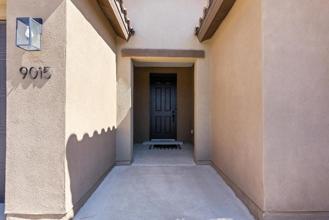 9015 Vista Dibujo Rd, Albuquerque, NM 87120 - doorway to property with stucco siding