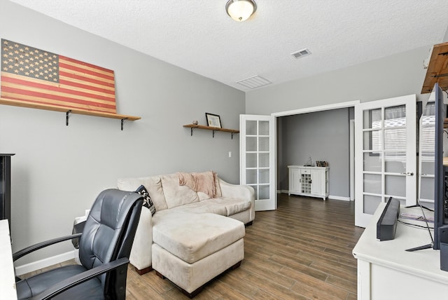 9015 Vista Dibujo Rd, Albuquerque, NM 87120 - office space featuring wood finished floors, french doors, and a textured ceiling