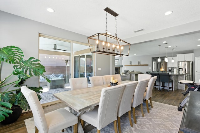 9015 Vista Dibujo Rd, Albuquerque, NM 87120 - dining room featuring dark wood-style flooring and recessed lighting