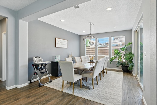 9015 Vista Dibujo Rd, Albuquerque, NM 87120 - dining space featuring wood finished floors, a textured ceiling, a chandelier, and recessed lighting