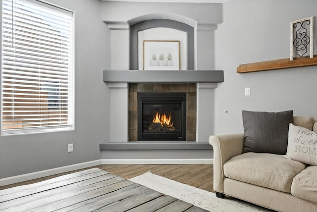 9015 Vista Dibujo Rd, Albuquerque, NM 87120 - living area featuring wood finished floors and a tile fireplace