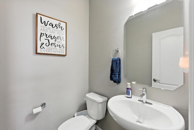 9015 Vista Dibujo Rd, Albuquerque, NM 87120 - half bathroom featuring a sink and toilet