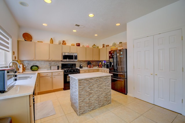 7024 Tree Line Ave NW, Albuquerque, NM 87114 - kitchen featuring appliances with stainless steel finishes, light countertops, decorative backsplash, a kitchen island, and light tile patterned floors
