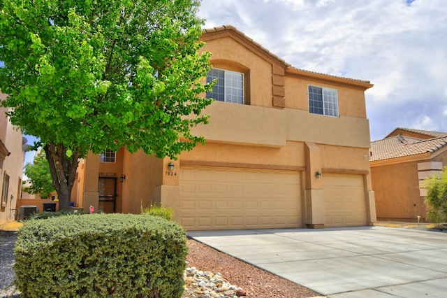 7024 Tree Line Ave NW, Albuquerque, NM 87114 - view of front of home featuring stucco siding, an attached garage, driveway, and a tiled roof