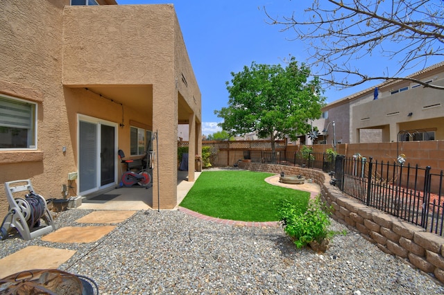 7024 Tree Line Ave NW, Albuquerque, NM 87114 - fenced backyard featuring a patio and a fire pit